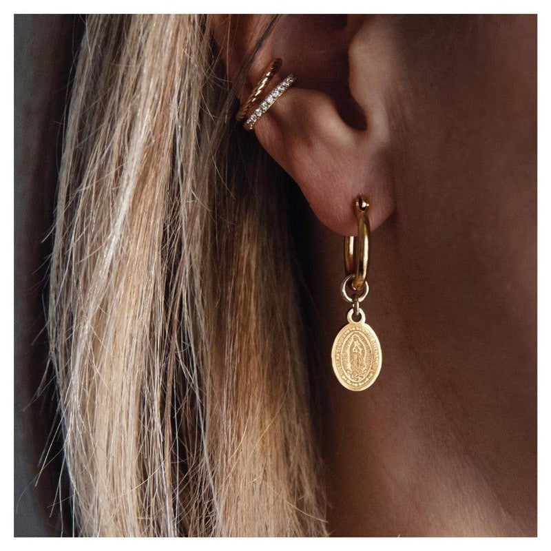 What do earrings symbolize in 2024?