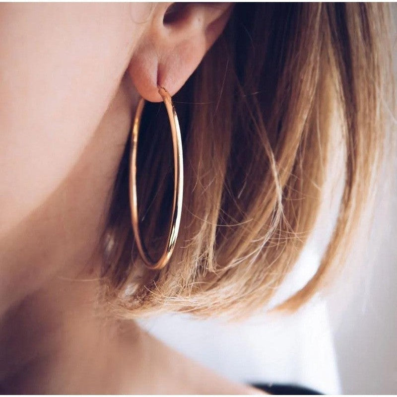 Quelle est l'origine des boucles d'oreilles créoles ?